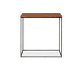 The Leende End Table features a rectangular European oak top in an oiled honey finish and a slender blackened steel frame, shown against a white background—an ideal piece of industrial accent furniture for modern interiors.