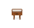 Part of the Leevi Collection, the Leevi End Table is crafted from solid acacia wood in a rich walnut brown finish and features a simple, modern design. It stands on four legs and includes one drawer with a rectangular metal handle, plus an open shelf above—making it the perfect mid-century end table for any contemporary space.
