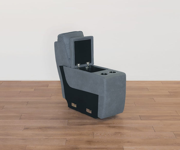 A Lunna Console in gray upholstery, designed for car or theater seating, features a modular structure with a raised storage compartment and two cup holders. It is shown placed on a wooden floor against a plain white wall.