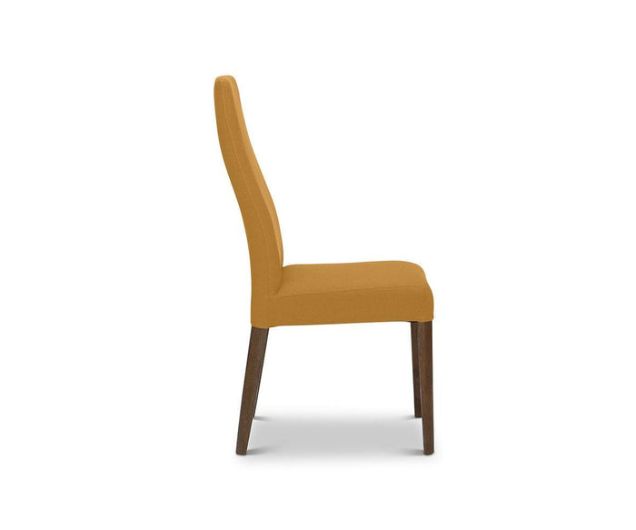 Side view of the Lussa Fabric Dining Chair featuring mustard yellow fabric upholstery and solid wood legs, set against a plain white background.