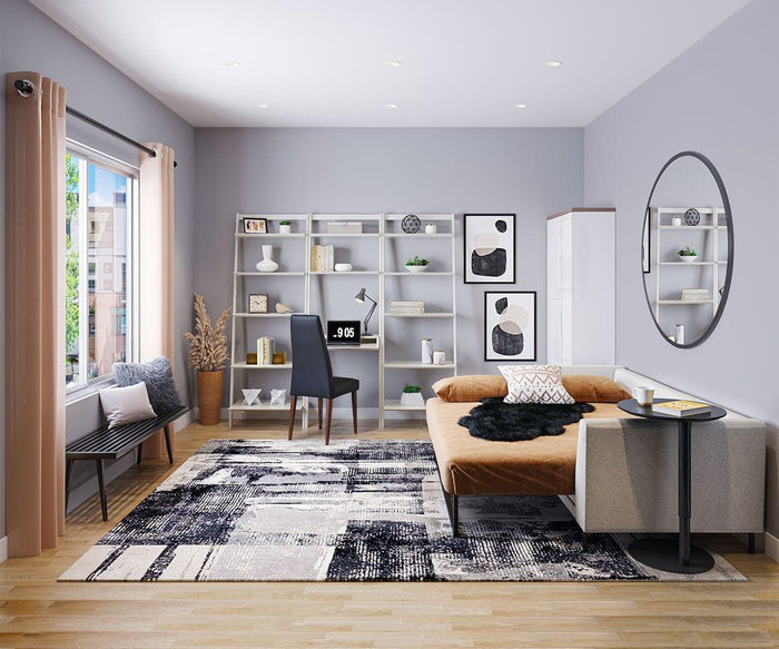 Modern living room with gray walls, a sofa, large round mirror, patterned rug, open shelves displaying decor, a desk paired with the Lussa Leather Dining Chair featuring leather upholstery and solid wood legs, a window with beige curtains, and light wood flooring.