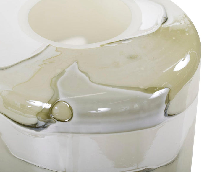 Close-up of the Malin Vase, a glossy, translucent tall vase in off-white and light green, featuring an abstract design with smooth, rounded edges and reflective surfaces in neutral tones.