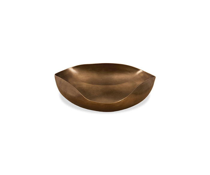 The Mara Dish is a shallow, round bowl crafted from metal with an aged bronze finish and smoothly curved edges. Featuring a modern, minimalist design, this dish serves as elegant décor when displayed against a white background.