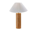 The Marta Table Lamp, in a natural finish, showcases a cylindrical wood base topped with a white pleated lampshade. Photographed against a plain white background, this modern lamp adds elegance and warmth to any space.