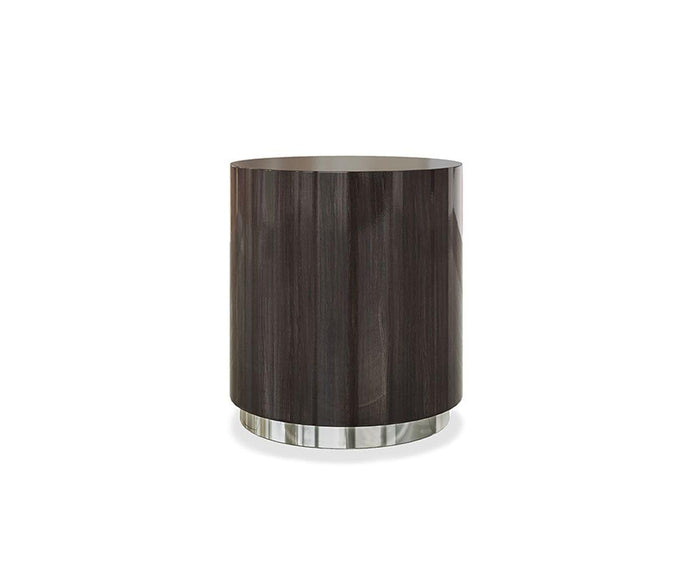The Massimo Round End Table, featuring a smokey oak veneer and a smooth, modern finish, stands on a metallic silver base against a plain white background.