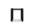 The Matteo Round End Table in Black Oak/Ceramic features a modern round top supported by three straight legs that extend just above the surface, creating partial circular handles on each side. Crafted with a minimalist and contemporary design, this solid oak end table brings a sophisticated touch to any space.