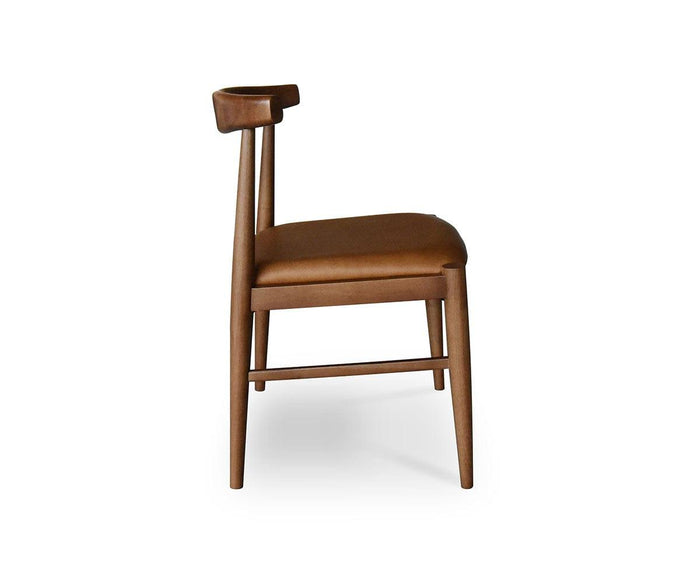 The Miles Leather Dining Chair showcases a Danish modern design, with a brown leather seat and a gracefully curved wooden backrest, presented in a side view against a white background.