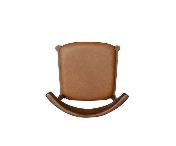 The Miles Leather Dining Chair, seen from the front against a plain white background, features a brown leather seat with a cushioned backrest and a curved base. Reminiscent of Danish modern design, it blends timeless contemporary style with the comfort of a classic dining chair.