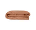 The E03 Mocha Mocha Duvet Cover, crafted from organic cotton bed linen, is neatly folded and placed against a plain white background.