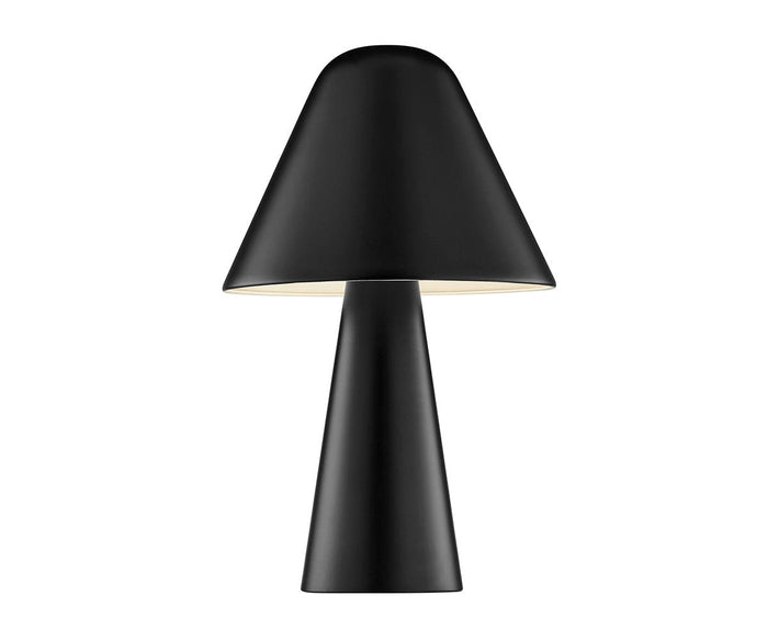 The Muga Table Lamp, in black, features a modern design with a conical base and a wide cone-shaped shade. The lamp is illuminated, casting a soft glow beneath the shade, set against a plain white background.