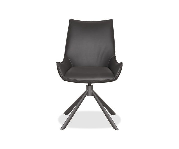 A sleek black Nomi Dining Chair, featuring a smooth faux leather seat, angled armrests, and four splayed metal legs, is displayed against a white background.
