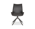 A sleek black Nomi Dining Chair, featuring a smooth faux leather seat, angled armrests, and four splayed metal legs, is displayed against a white background.