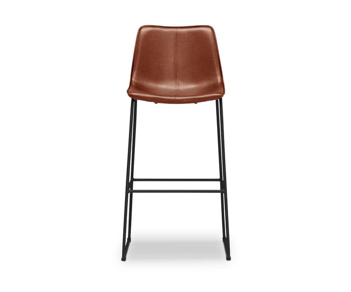 A modern minimalist bar stool, the Oken Bar Stool features a saddle leather seat and backrest complemented by sleek black metal legs and a convenient footrest, shown against a white background.