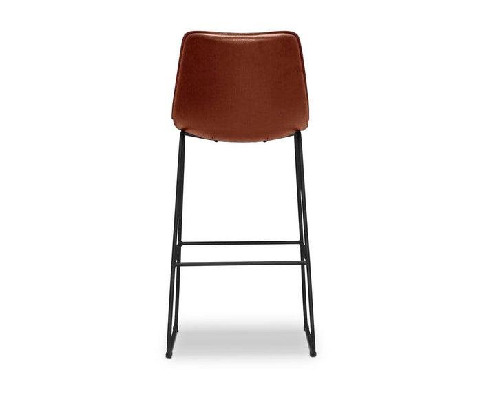The Oken Bar Stool, shown from the back against a white background, features a brown cushioned seat with a high backrest, complemented by sturdy black metal legs and convenient footrests for a sophisticated modern look.