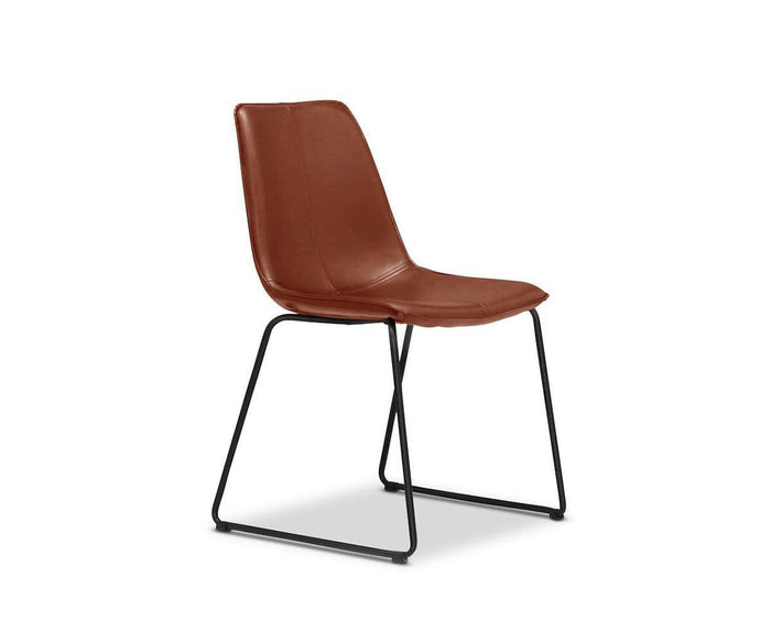 The Oken Dining Chair showcases a modern design with a brown leather seat and backrest, complemented by slim black metal legs in a sled base style. This minimalist dining chair is set against a white background.