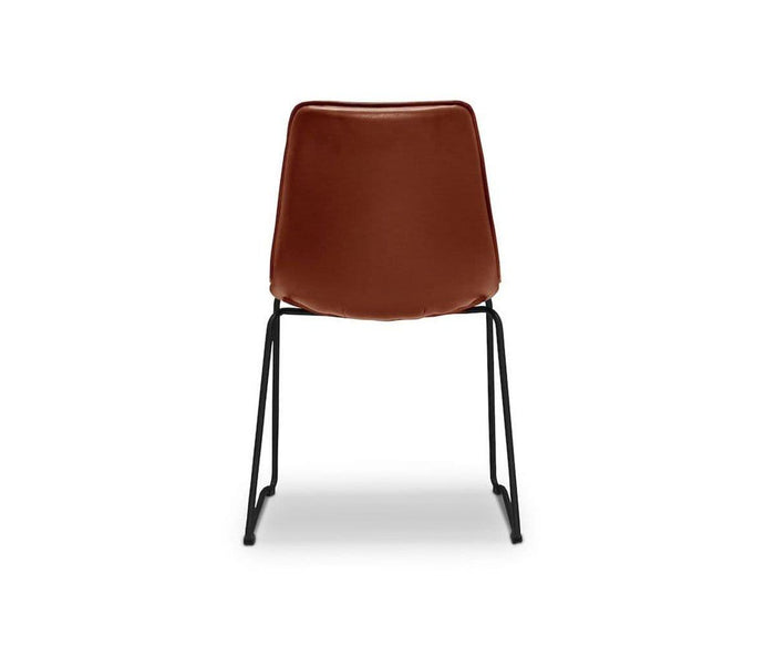 The Oken Dining Chair is a brown leather minimalist dining chair with a simple metal frame, shown from the back against a white background.