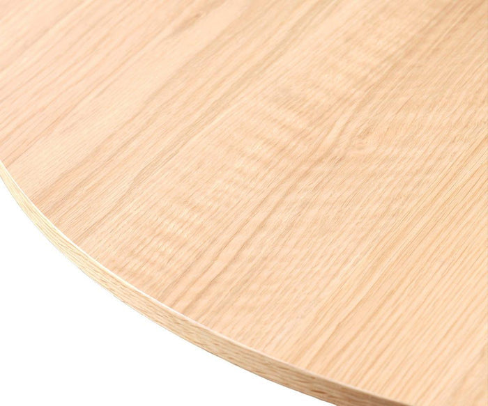 Close-up of the Orella Round Coffee Table, featuring a smooth, light-colored wooden tabletop with visible wood grain patterns and elegant tambour paneling—an ideal modern accent piece for your living room.