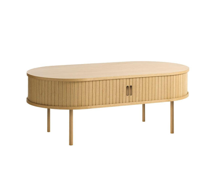 The Orella Storage Coffee Table features an oval wooden design with vertical slatted sides inspired by tambour paneling, two central cabinet handles, and four straight legs. This coffee table showcases a minimalist, modern aesthetic ideal for contemporary living rooms.