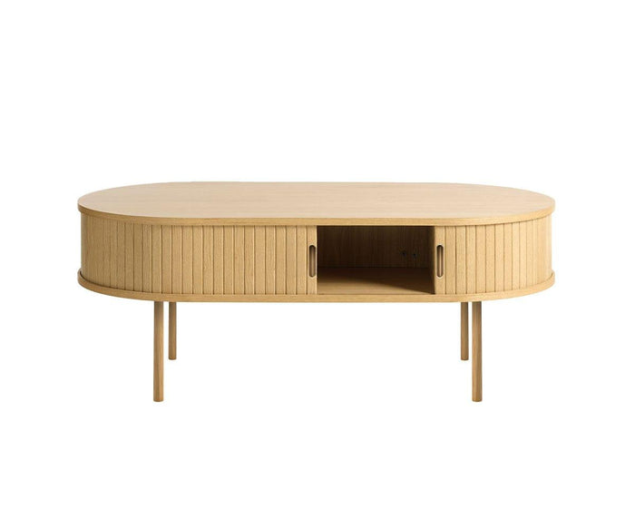 Introducing the Orella Storage Coffee Table—a light wood, oval design featuring vertical tambour-inspired grooves, two sliding doors, an open center compartment, and four slender legs. Perfect for bringing understated elegance and versatile storage to your modern living room.