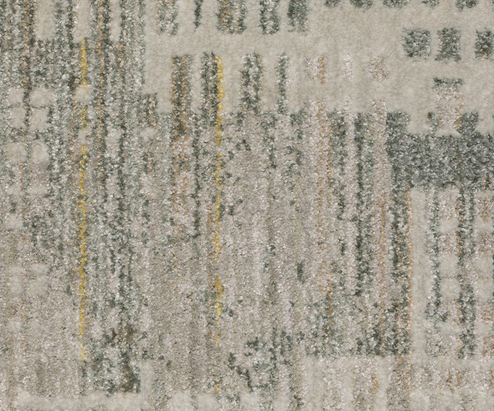 A close-up of the Oriental Weaver Mallory / MAL03 Rug showcases its textured, power-loomed surface featuring an abstract and modern pattern of vertical and horizontal lines in gray, beige, white, and hints of yellow. Crafted from space-dyed polypropylene, this design combines style with durability.
