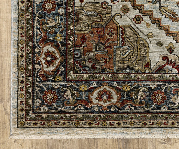 Corner of an ornate, multicolored Oriental Weavers Aberdeen / 1144W Rug featuring intricate floral and geometric patterns on a wooden floor, with visible fringes along the edge, exuding boho charm and Persian-inspired elegance.