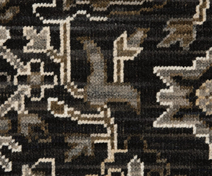 Close-up of the Oriental Weavers Acacia / ACA05 Rug featuring geometric and abstract patterns in black, gray, beige, and white hues. The visible fabric texture highlights the meticulous craftsmanship characteristic of this Acacia collection rug.