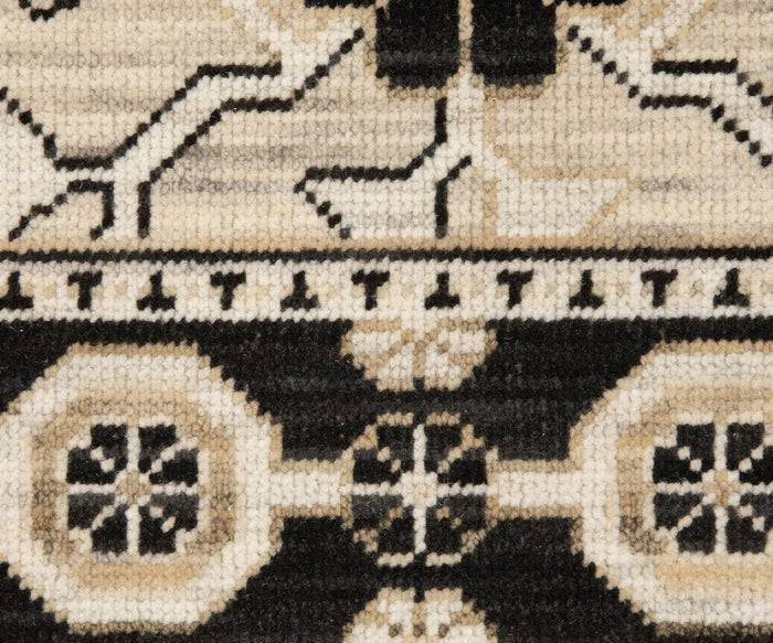 Close-up of the Oriental Weavers Acacia / ACA09 Rug, a boho-style piece featuring geometric patterns in black, cream, and beige with octagonal shapes, lines, and delicate floral motifs—beautifully crafted on an Axminster loom.