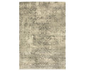 The Oriental Weavers Astor / 1806Q Rug is a rectangular area rug from the Astor Collection, showcasing a distressed, vintage-inspired motif in beige and multi colors. Its plush pile lends an antique, textured appearance with a worn look.
