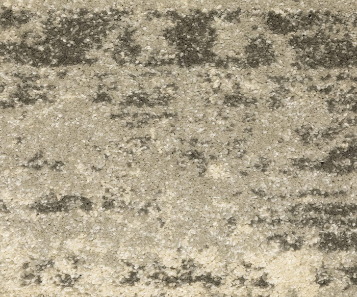 Close-up view of granulated white and light brown salt scattered densely, creating a textured surface with uneven coloration and intricate patterns throughout—reminiscent of the luxurious design of the Oriental Weavers Astor / 1806Q Rug, where vintage-inspired motifs and rich textures lend depth and captivating visual interest.