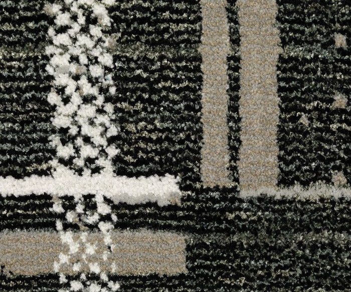 Close-up of the Oriental Weavers Atlas / 752C Rug, this machine-woven carpet from the Atlas Collection features textured black, gray, and white fibers with intersecting lines and geometric shapes—an ideal choice for high-traffic areas.