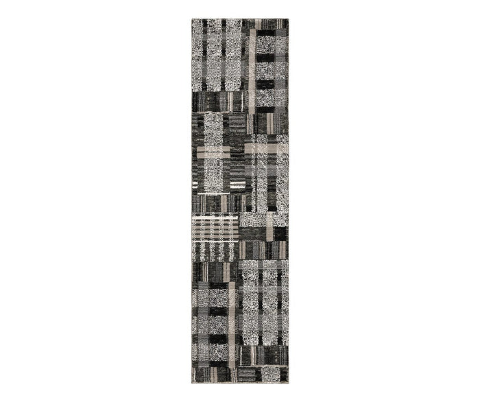 The Oriental Weavers Atlas / 752C Rug is a rectangular runner from the Atlas Collection, machine-woven with a black and multi-colored patchwork design featuring an array of geometric and textured patterns arranged in a grid—ideal for high-traffic areas.