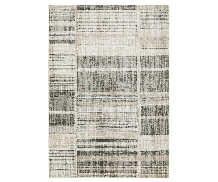 The Oriental Weavers Cambria / 55X Rug is a rectangular area rug featuring a modern, abstract plaid pattern in versatile multi-toned shades. Crafted from durable polypropylene yarn, its overlapping lines and blocks add textured depth for a contemporary look that’s both stylish and easy to maintain.