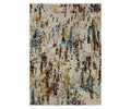 The Oriental Weavers Capella / CAP11 Rug features a rectangular design with an abstract pattern in a multi-color palette, including blue, brown, beige, gold, and hints of gray that resemble scattered or dripping paint on a light background. Crafted from soft space-dyed polyester, this rug delivers subtle color variations and texture for a modern aesthetic.