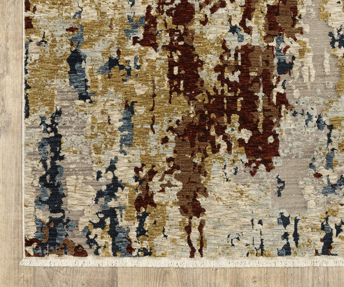 The Oriental Weavers Capella / CAP11 Rug is a rectangular area rug with an abstract pattern in beige, gold, burgundy, and navy blue tones. Featuring subtle geometric designs and fringed edges, it is crafted from space-dyed polyester and placed on a light wood floor. This rug brings a touch of bohemian flair to any room.
