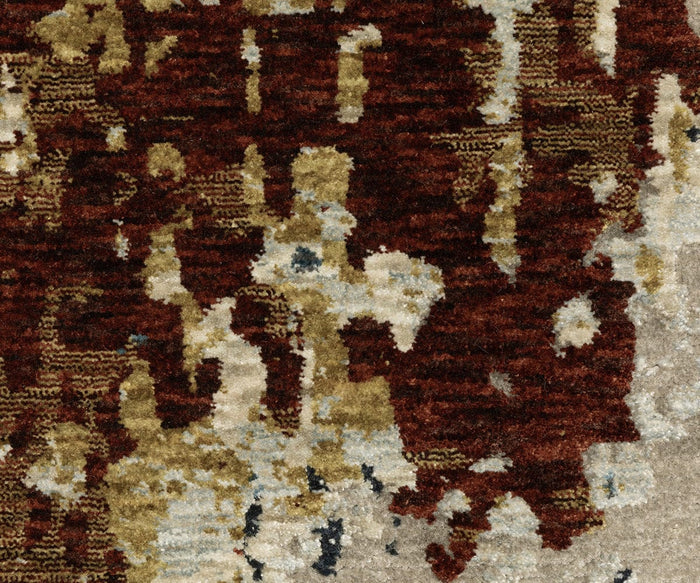 A close-up of the Oriental Weavers Capella / CAP11 Rug showcases its textured surface with an abstract pattern in shades of brown, beige, gold, and cream, featuring irregular shapes and mottled coloration crafted from space-dyed polyester for enhanced depth and vibrancy.