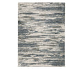 The Oriental Weavers Caravan / 750W Rug is a rectangular area rug from the Caravan Collection, showcasing an abstract, nature-inspired pattern in a multi-color palette with shades of gray, blue, and cream that evoke brushstrokes or watercolor streaks. Crafted from space-dyed polyester, this rug offers both visual interest and subtle texture.