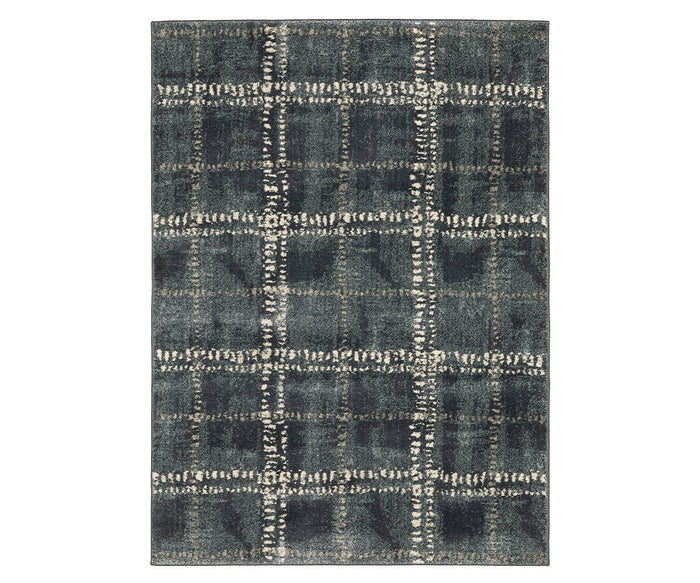 The Oriental Weavers Carson / 746J Rug in Grey/Multi features a rectangular design with a dark blue and gray background, accented by a distressed white and tan plaid pattern. Part of the Carson Collection, this contemporary rug showcases a textured, vintage-inspired look with a grid-like effect across its surface. Crafted from durable polypropylene, it effortlessly combines style and practicality for any living space.