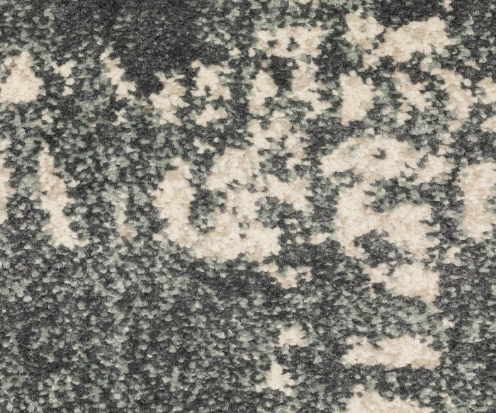Close-up of the Oriental Weavers Carson / 746J Rug, showcasing its textured surface and abstract mottled design in gray, black, and beige tones. Part of the Carson Collection, this contemporary rug is crafted from durable polypropylene for lasting style and resilience.