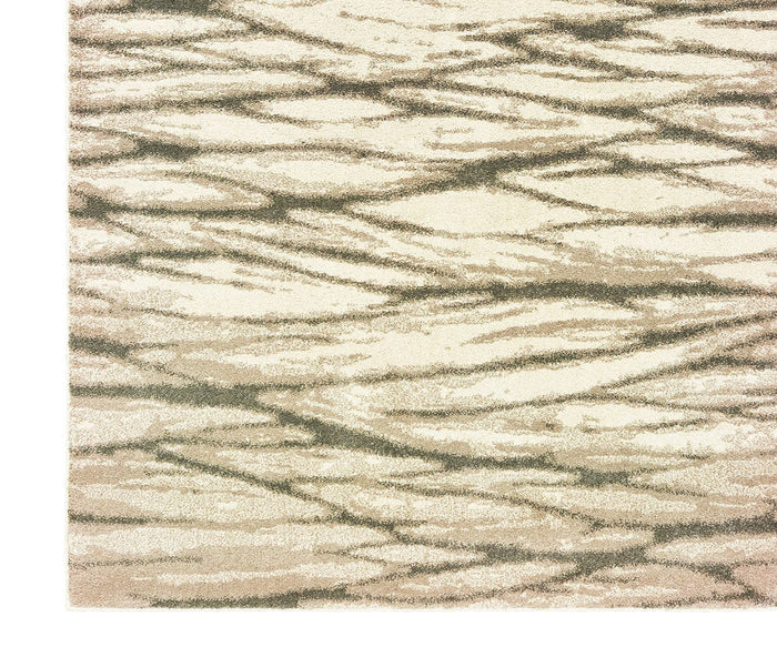A close-up of the Oriental Weavers Carson / 9671C Rug reveals a contemporary design featuring a beige background adorned with abstract wavy lines in shades of brown and gray, evoking the look of flowing water or sand. Made from durable polypropylene, this plush carpet blends modern style with comfort, making it an ideal addition to any space.