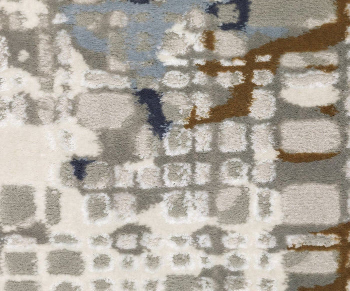 Featuring intersecting grids in shades of white, gray, blue, and brown, the Oriental Weavers Easton / 11E Rug showcases a textured modern design reminiscent of contemporary fabric or rug patterns. Power-loomed for durability, this rug from the Easton Collection blends soft and bold irregular geometric shapes into a striking abstract pattern that combines style with resilience.