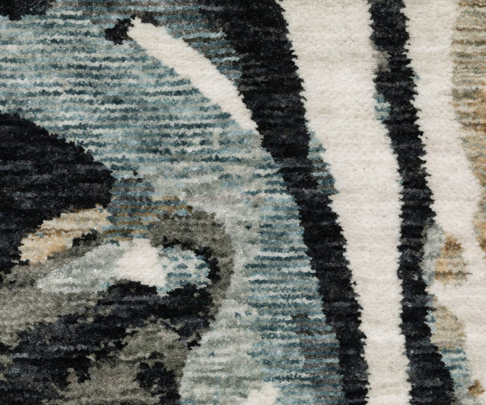 Close-up of the Oriental Weavers Echo / ECH07 Rug, a power-loomed rug made in Egypt, highlighting its textured surface and abstract pattern in shades of blue, black, white, and beige with a mix of curved and straight lines.