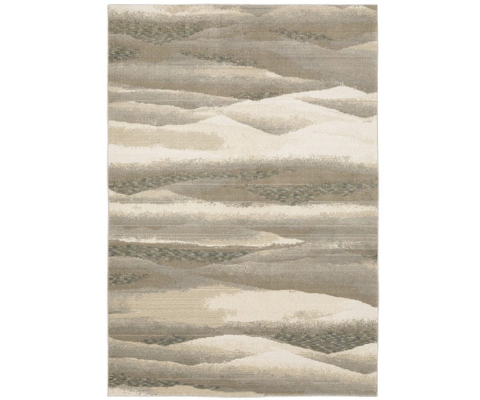 The Oriental Weavers Evolution / 982C Rug is a rectangular area rug from the Evolution Collection, showcasing an abstract, wavy pattern in neutral beige and multi-colored tones reminiscent of layered hills or sand dunes. Crafted from durable nylon, this rug offers both style and resilience for everyday living spaces while remaining easy to maintain.