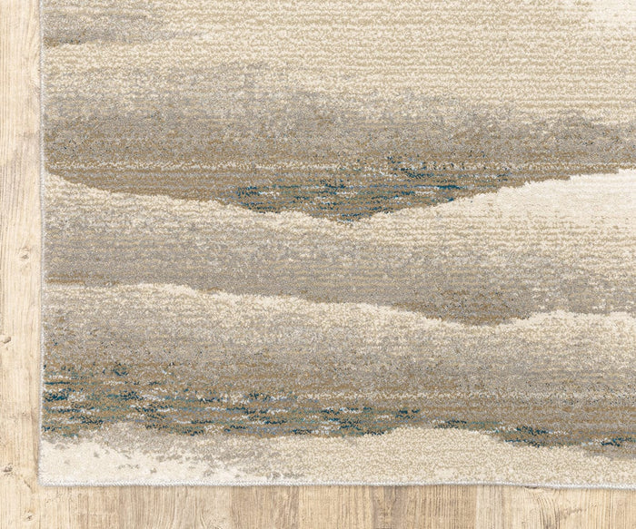 A corner of the Oriental Weavers Evolution / 982C Rug, featuring a beige and gray abstract wavy pattern in neutral tones, sits atop a light wood floor. This durable nylon rug from the Evolution Collection offers easy maintenance while bringing modern elegance to your space.