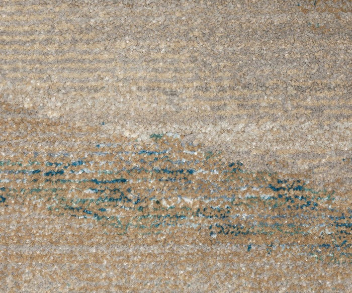 Close-up of the Oriental Weavers Evolution / 982C Rug, showcasing its textured surface in beige, tan, and blue hues. The abstract pattern features wave-like brush strokes accented by scattered flecks of color and a soft, woven look. Made from durable nylon fibers, this rug is easy to maintain and offers lasting elegance for your home.