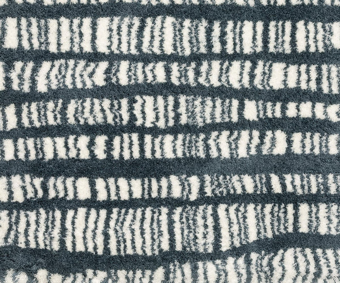 Close-up of the Oriental Weavers Galileo GAL01 Rug, showcasing its dense microfiber polyester pile and modern design featuring alternating rows of irregular, wavy blue and white stripes. The richly textured surface offers a plush, soft feel and dynamic visual appeal from the Galileo Collection.