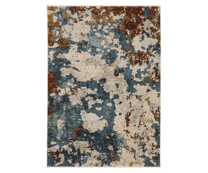 The Oriental Weavers Hayden / HAY01 Rug features a rectangular shape with an abstract, splattered design in a blend of blue, cream, rust, and beige colors. Crafted from space-dyed polyester in a multi-color palette, this rug adds modern style and durable softness to any room.