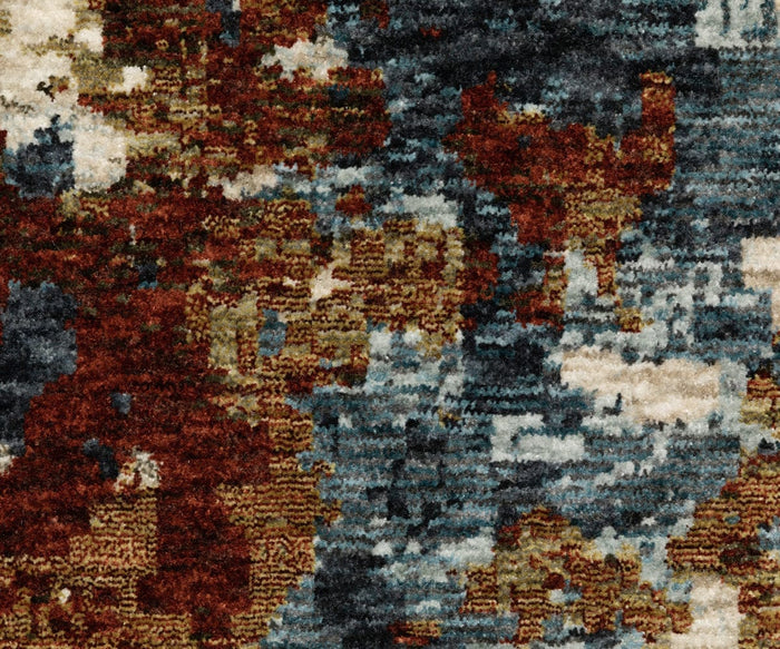 Abstract close-up of the Oriental Weavers Hayden / HAY01 Rug, a space-dyed polyester rug displaying mottled patterns in brown, beige, blue, and cream for an organic, painterly look.