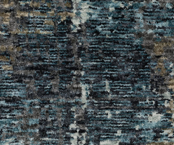Close-up of a textured carpet with a blue, gray, and beige abstract pattern, resembling brush strokes or layered woven threads—this space-dyed polyester rug from the Oriental Weavers Hayden HAY03 collection offers a striking abstract design for modern interiors.