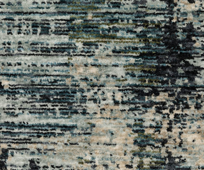 The Oriental Weavers Hayden HAY04 Rug showcases an abstract, close-up design with textured carpet featuring a mix of blue, gray, beige, and black horizontal and vertical streaks for a striking modern pattern. Crafted from space-dyed polyester, this rug offers captivating visual depth and contemporary style.