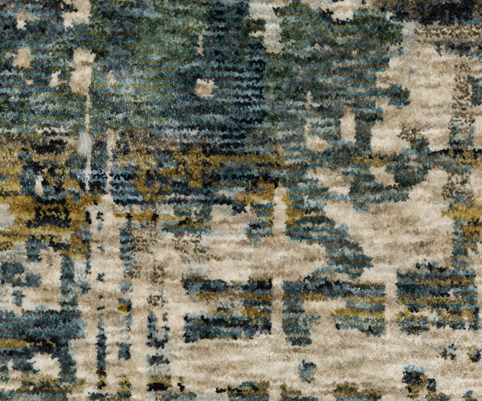 The Oriental Weavers Hayden HAY05 Rug showcases an abstract design in shades of beige, blue, green, and gray, with blurred, irregular shapes and lines creating a dynamic pattern across its surface. Crafted from space-dyed polyester, this rug delivers a distinctly modern aesthetic.